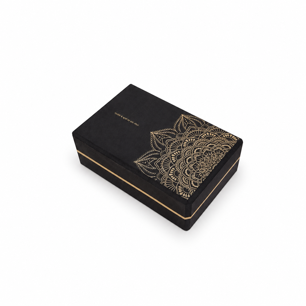 Black yoga block with a gold botanical pattern